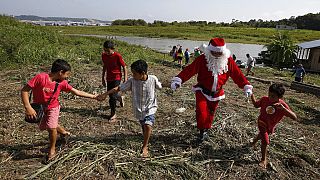 Father Christmas delivers gifts to Brazilian Amazon communities